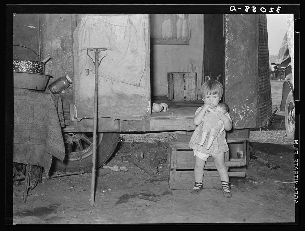 Child in front of trailer home of migrant parents. Weslaco, Texas. See 32108-D caption by Russell Lee