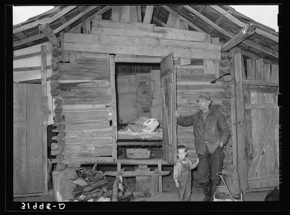 Mot Tucker in front of corncrib home showing sleeping quarters. Antioch, Mississippi by Russell Lee