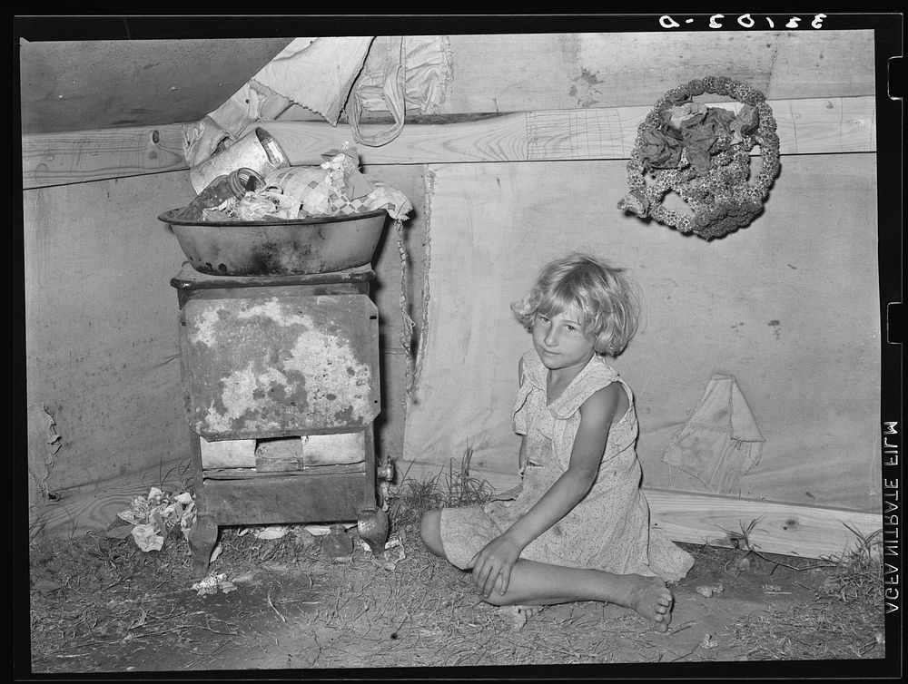 Daughter of white migrants in tent home. Weslaco, Texas. See caption 32108-D by Russell Lee