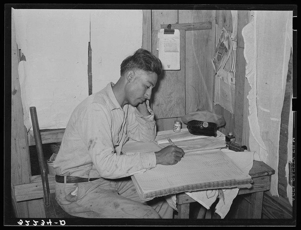 Mexican labor contractor working on his books. Robstown, Texas by Russell Lee