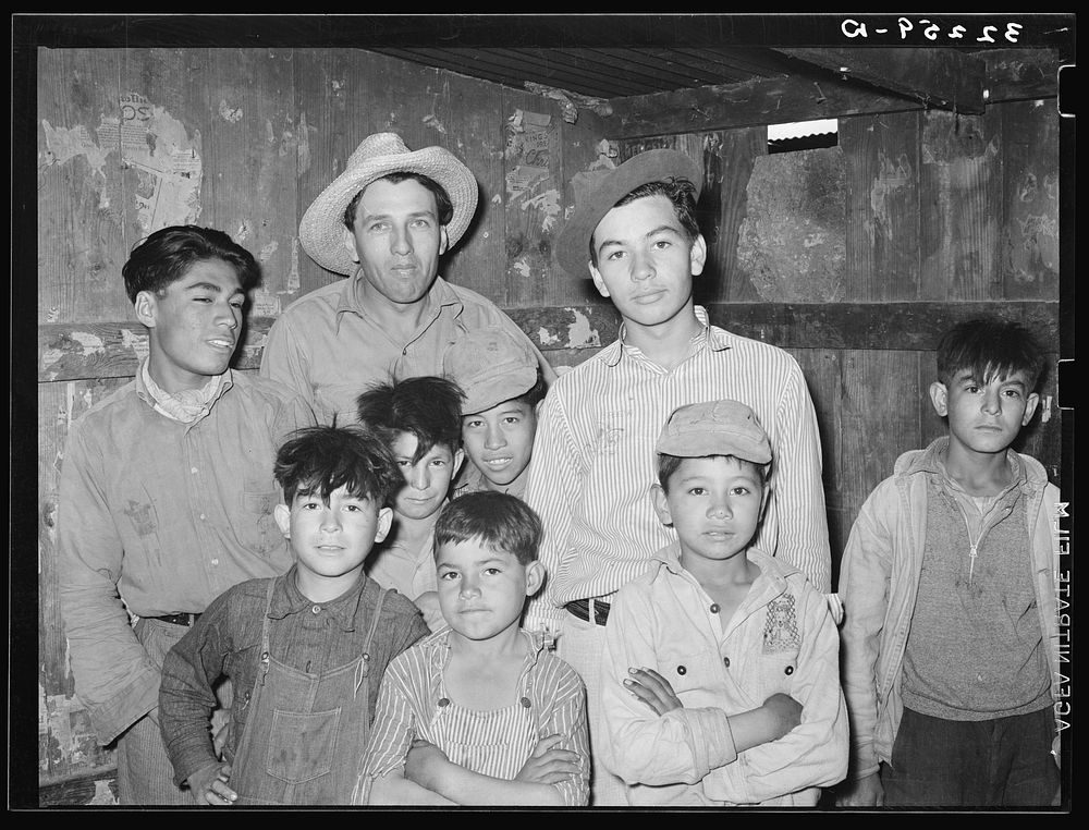 Mexican men and children who live in corral. Robstown, Texas by Russell Lee