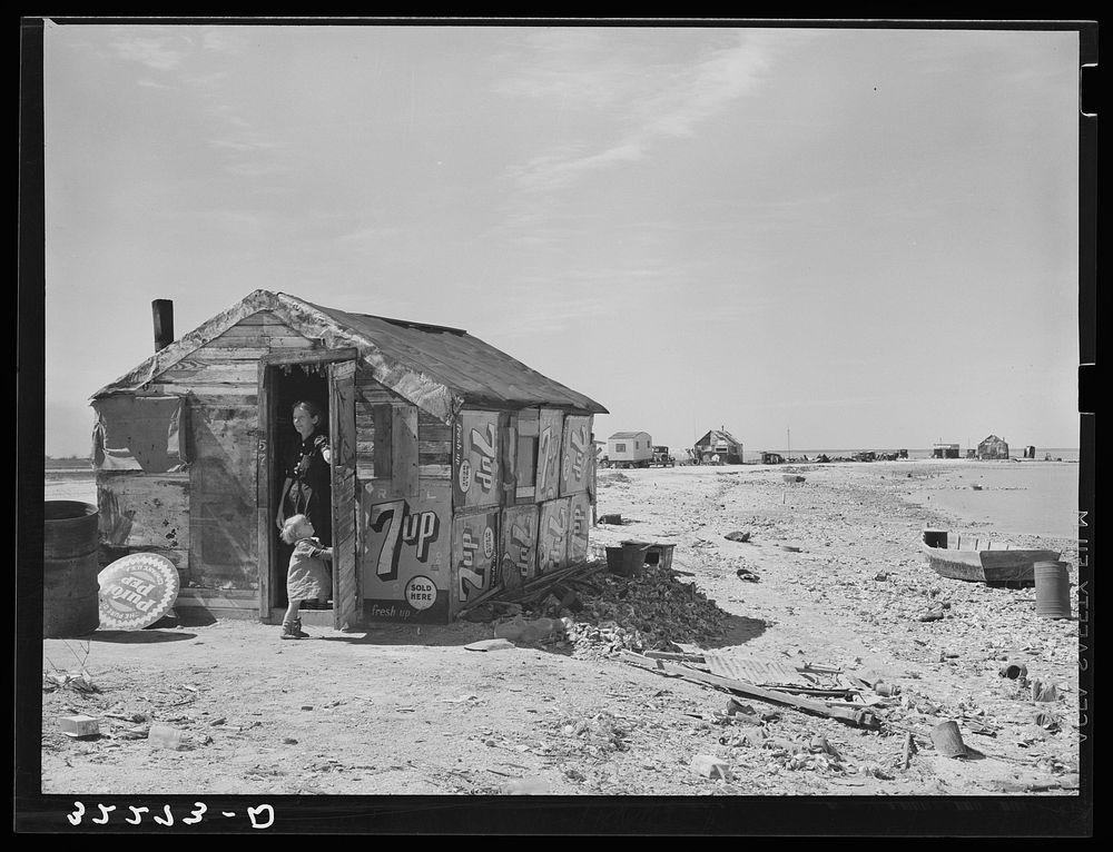 Shack of war veteran with view along Nueces Bay. Corpus Christi, Texas by Russell Lee