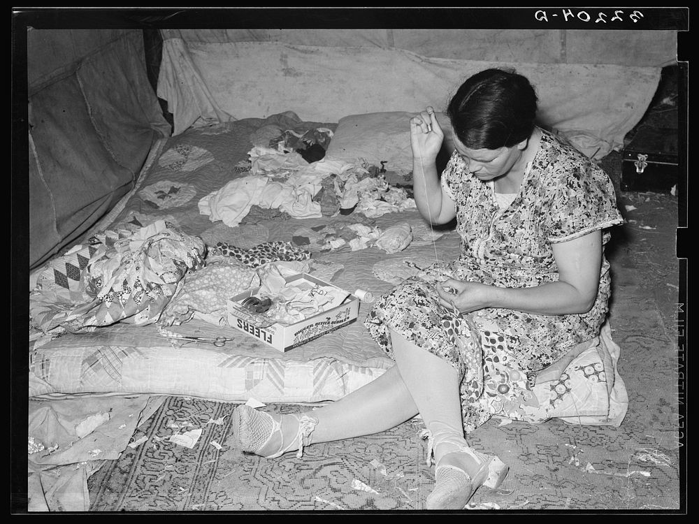 White migrant mother piecing a quilt. Harlingen, Texas. See 32108-D by Russell Lee