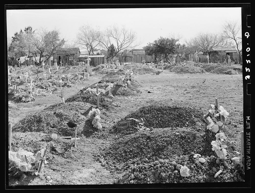 New Mexican graves in cemetery. Raymondville, Texas by Russell Lee