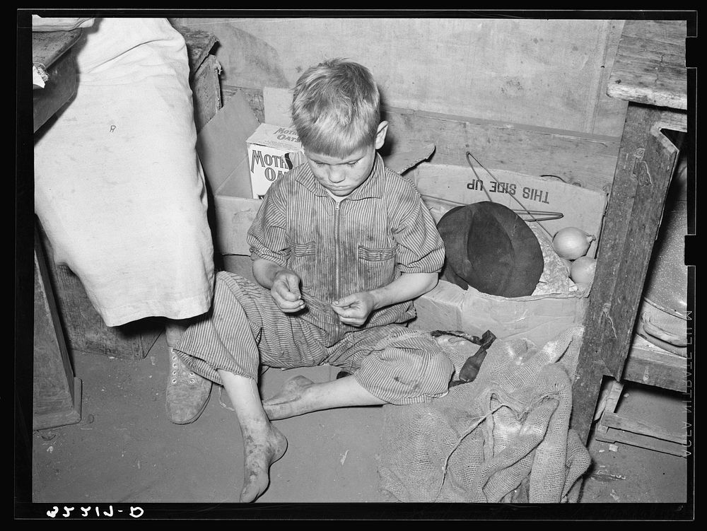 Son of white migrant worker in tent home near Harlingen, Texas by Russell Lee