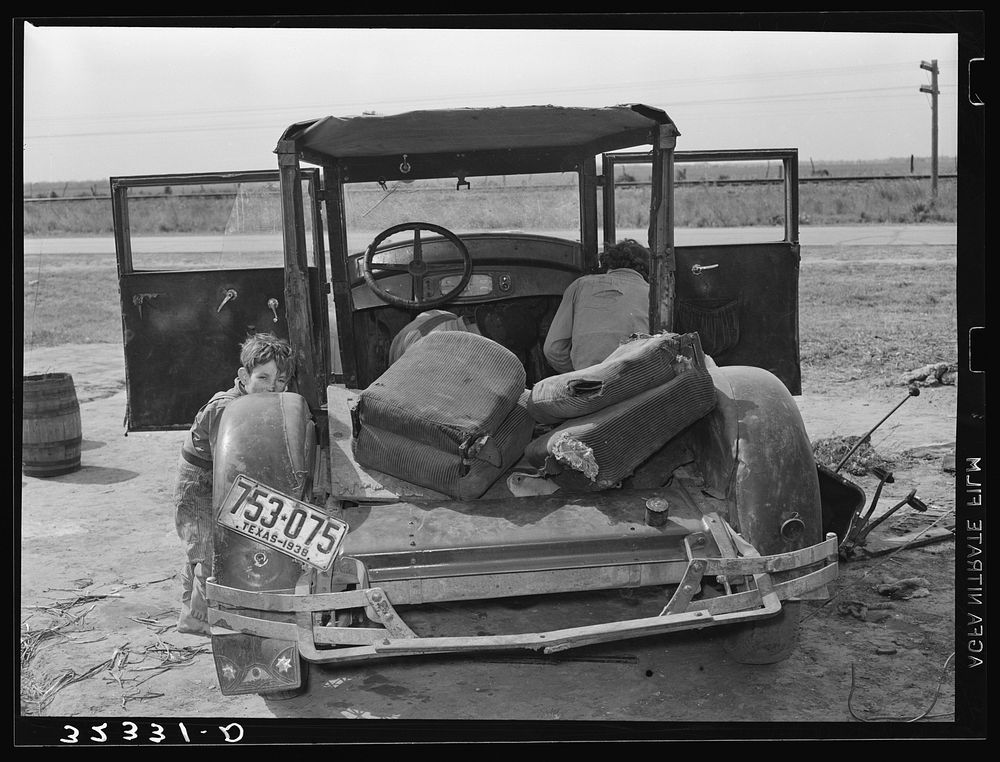 Car of  migrant worker being repaired by owner near Harlingen, Texas by Russell Lee