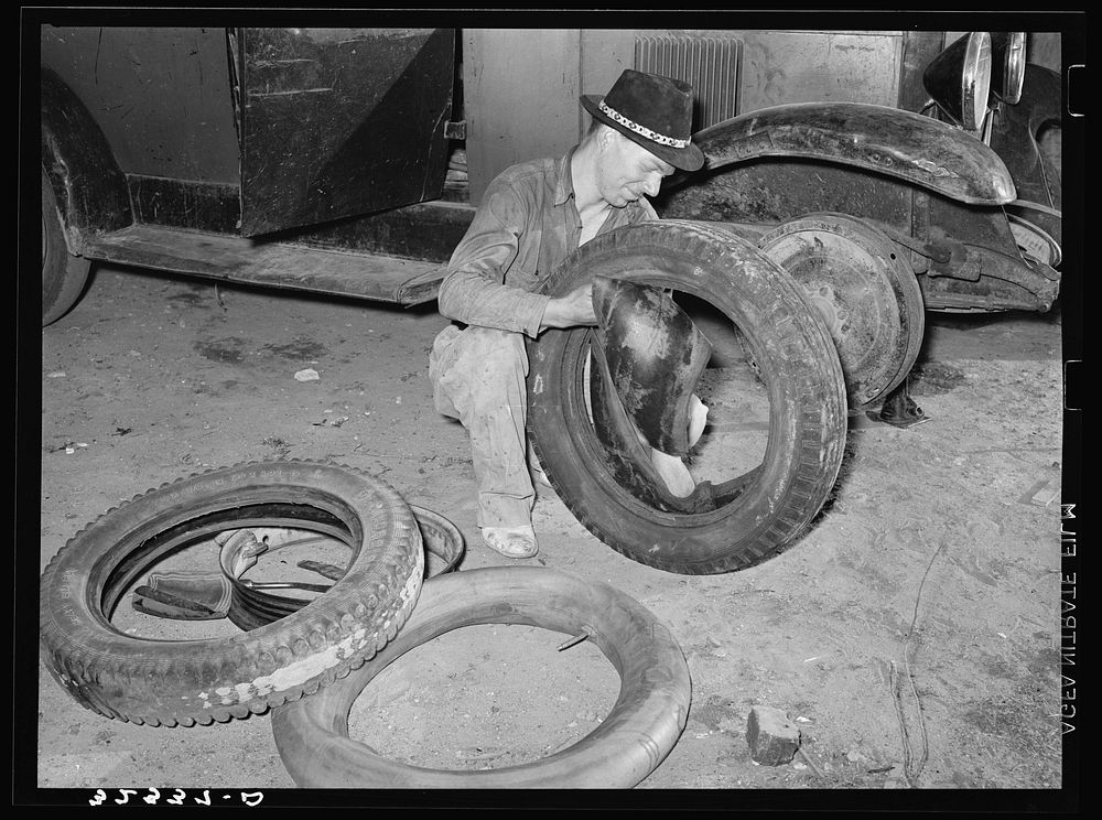 White migrant changing tires. Edinburg, Texas by Russell Lee