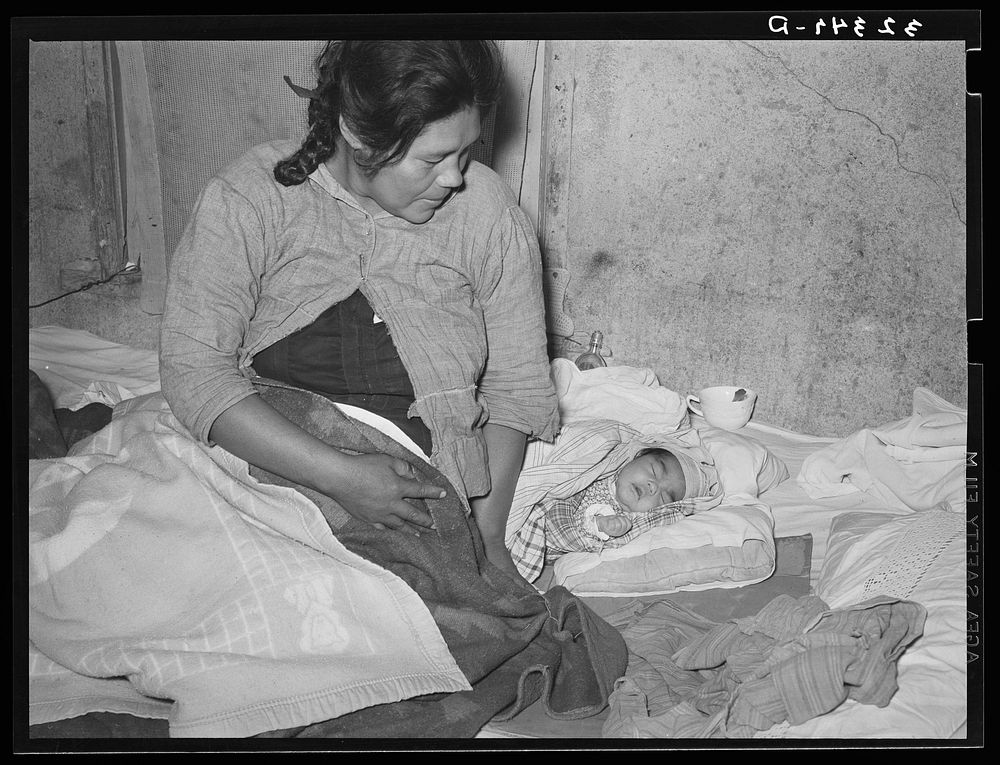 Mexican mother with three days old baby, born in this home. Crystal City, Texas by Russell Lee