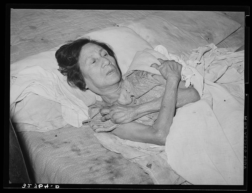 Mexican woman with advanced case of arthritis. She has been confined to bed for several years. Crystal City, Texas by…