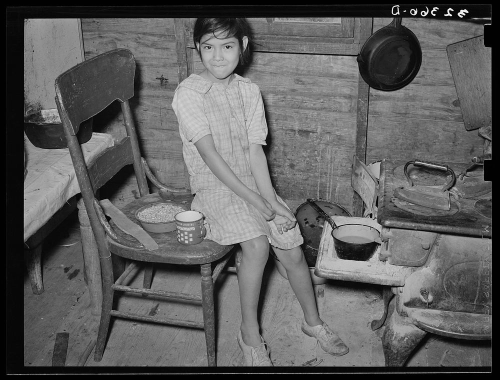 [Untitled photo, possibly related to: Mexican child with dried beans which play a large part in the Mexican diet. Crystal…