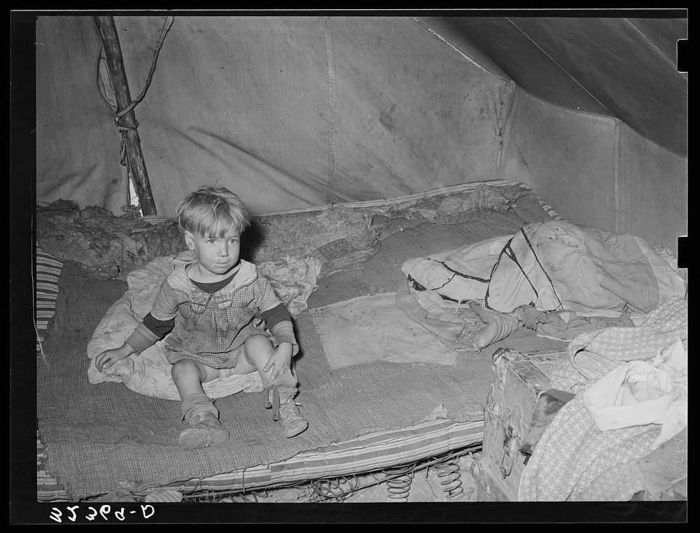Child of white migrant in tent home. Corpus Christi, Texas by Russell Lee