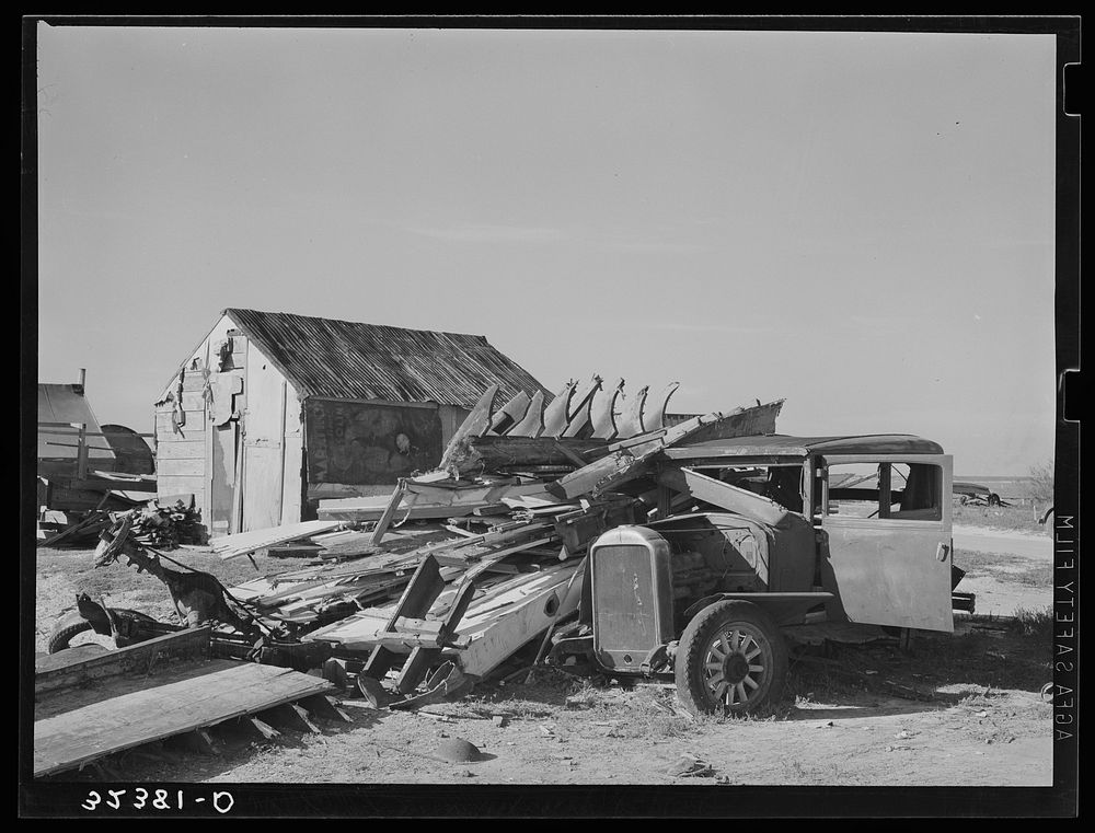 Abandoned automobile and wrecked house. Crystal City, Texas. Mexican section by Russell Lee