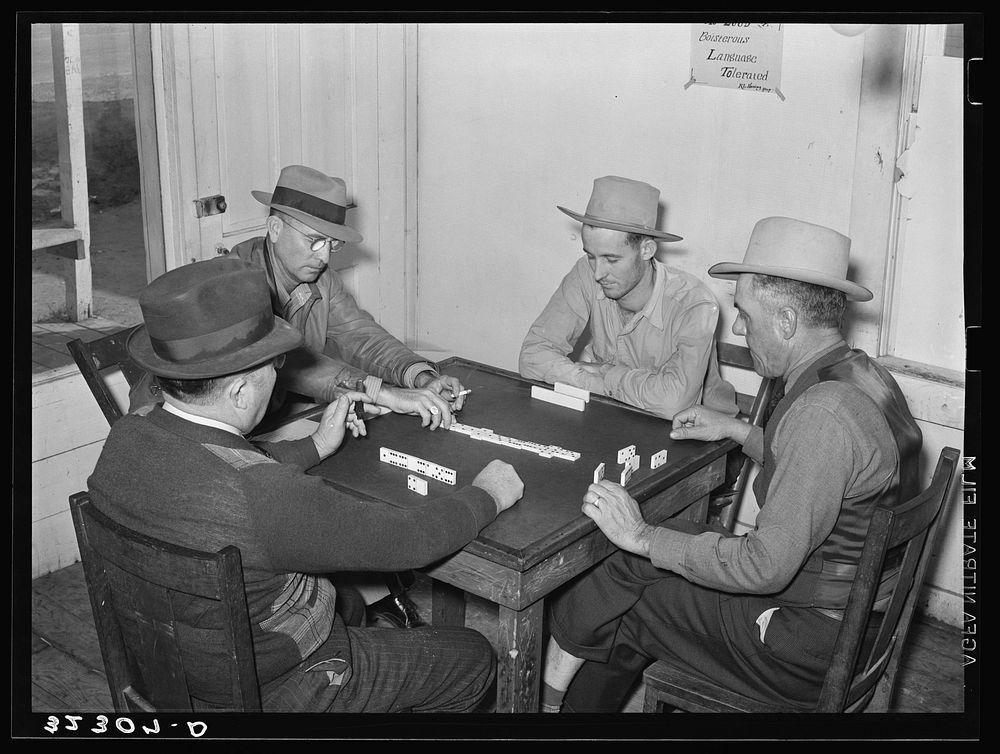 Domino game in beer parlor. Sebastian, Texas by Russell Lee