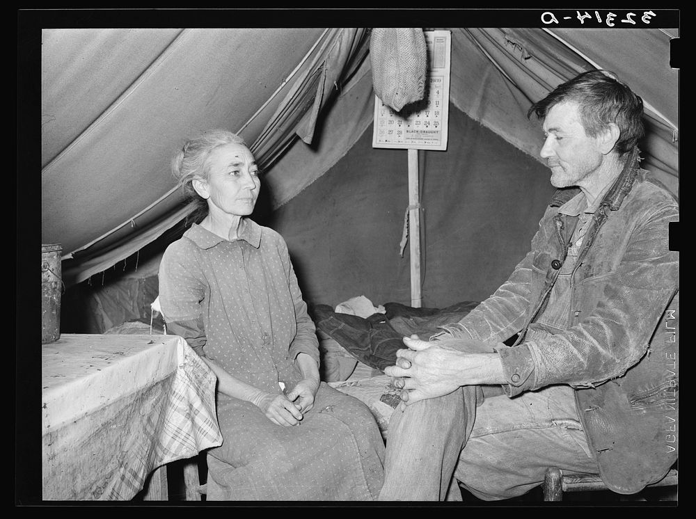 White migrant and his wife in camp near Sebastian, Texas. Both are west Texans who have come to the valley for the winter…