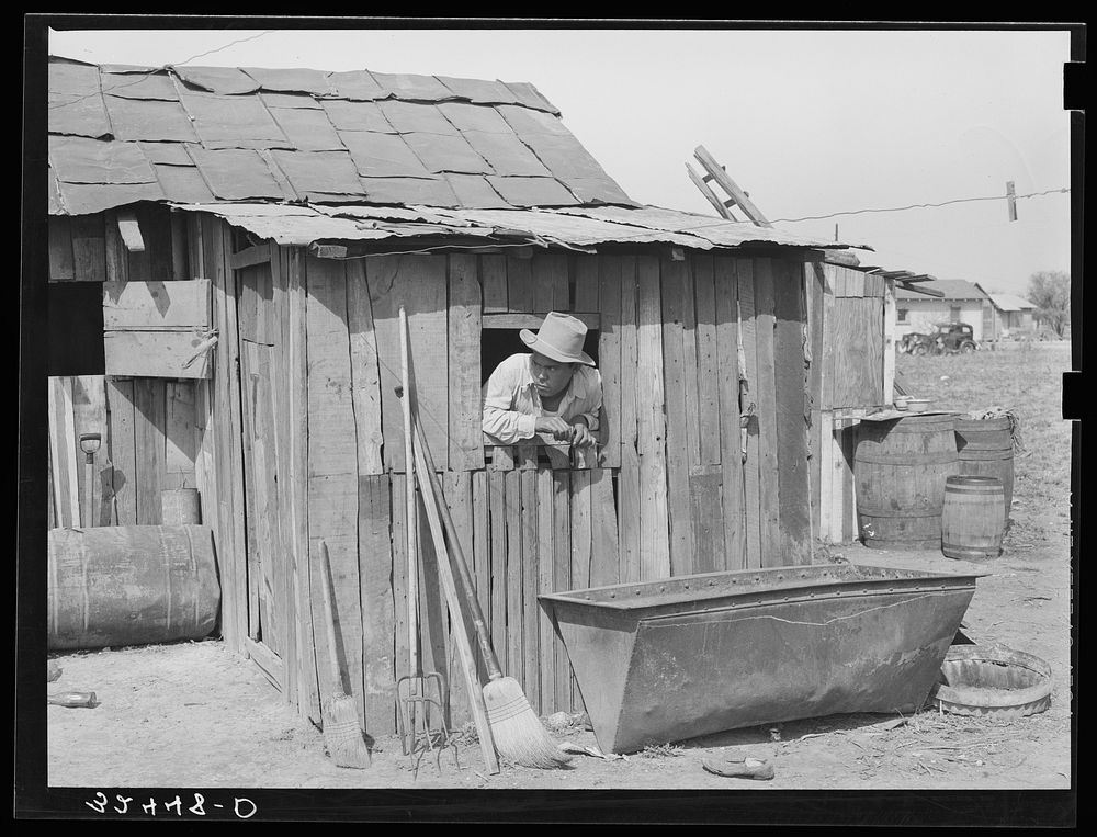 Mexican house, San Antonio, Texas. Notice roof made of sheet metal by Russell Lee