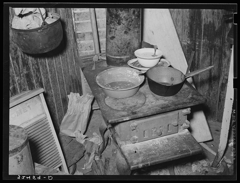 Stove and other articles in kitchen of Mexican living in San Antonio, Texas by Russell Lee