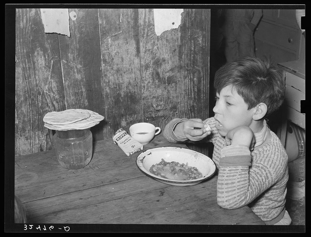 Mexican boy eating lunch. San Antonio, Texas by Russell Lee