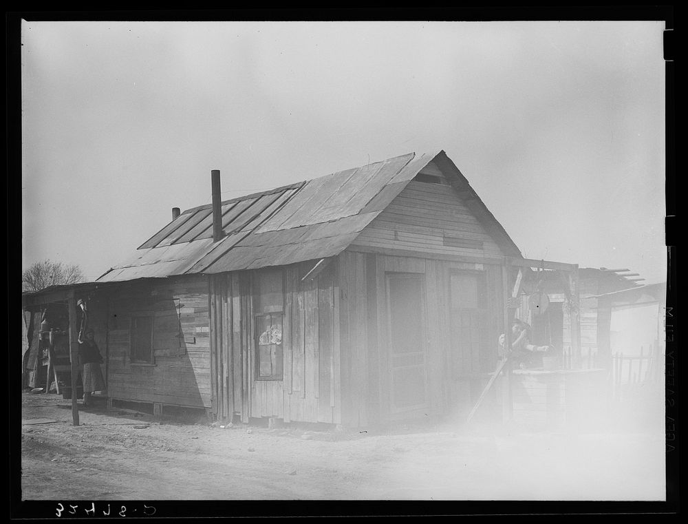 [Untitled photo, possibly related to: Yard and house of Mexican. San Antonio, Texas] by Russell Lee