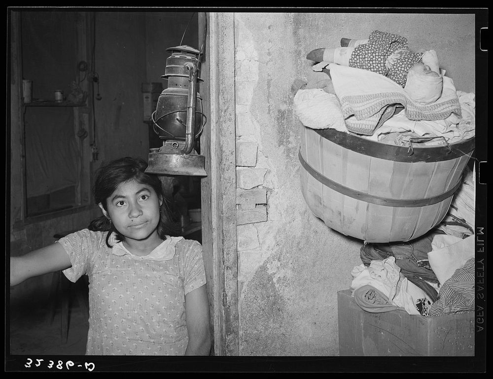 Mexican girl in doorway of home. Crystal City, Texas by Russell Lee