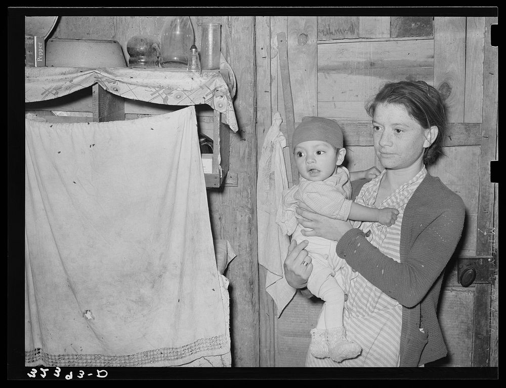 Mexican mother and child in their home. Note flies which are prevalent in all these Mexican homes. Crystal City, Texas by…