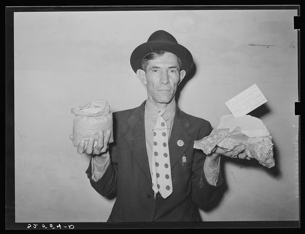[Untitled photo, possibly related to: Mexican pecan workers union official displaying relief supplies which are supposed to…