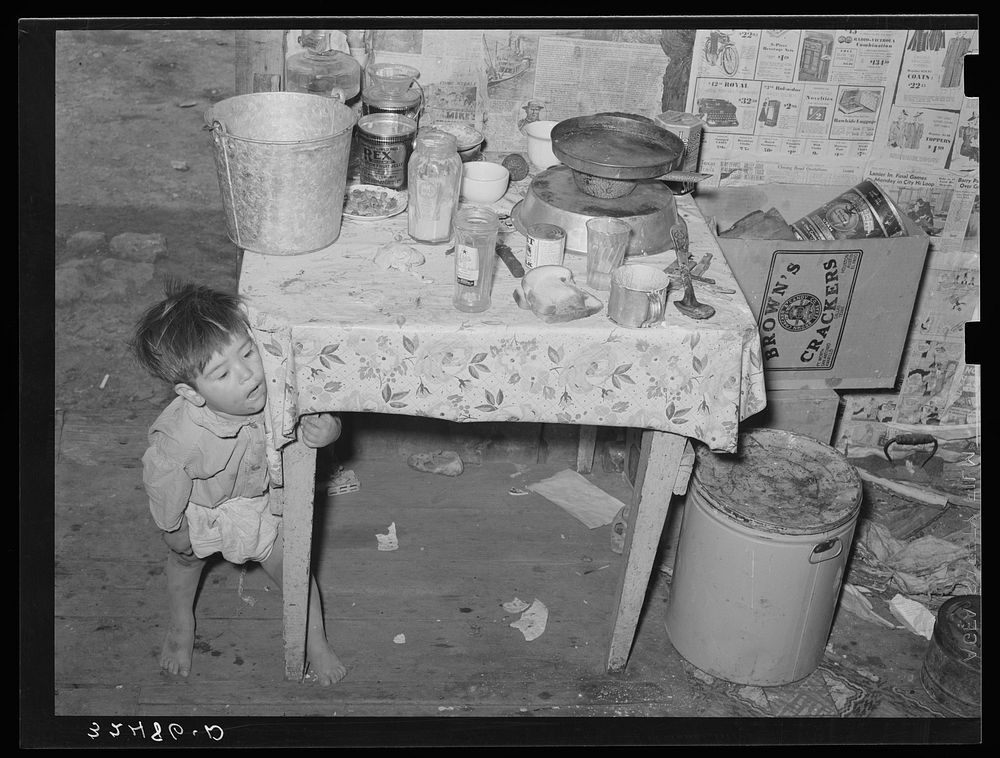 Mexican child in kitchen. San Antonio, Texas by Russell Lee