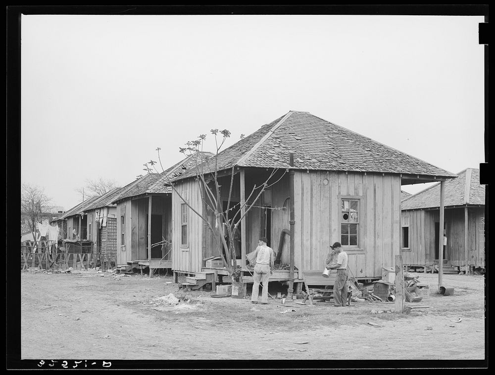Row of houses. Mexican quarter, San Antonio, Texas by Russell Lee