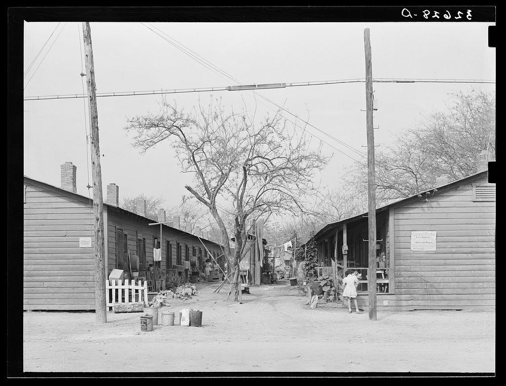 Row of houses facing on corral. Mexican section, San Antonio, Texas by Russell Lee
