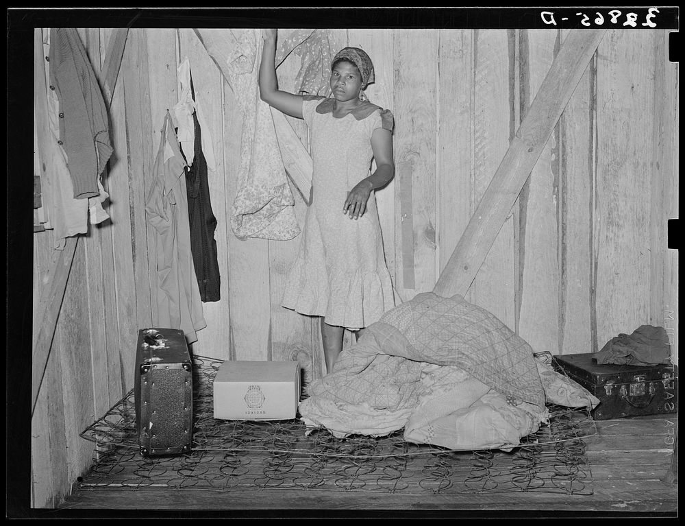  woman, strawberry picker, arranging her living quarters near Hammond, Louisiana by Russell Lee