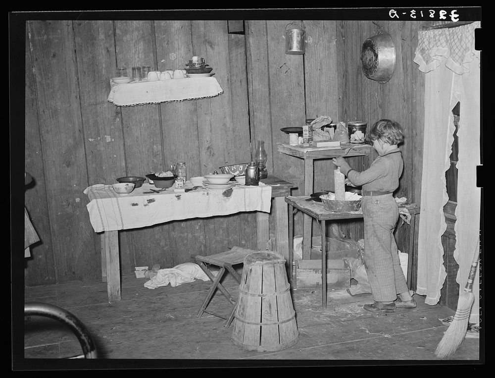 Interior of temporary home of white migrant strawberry pickers near Ponchatoula, Louisiana by Russell Lee