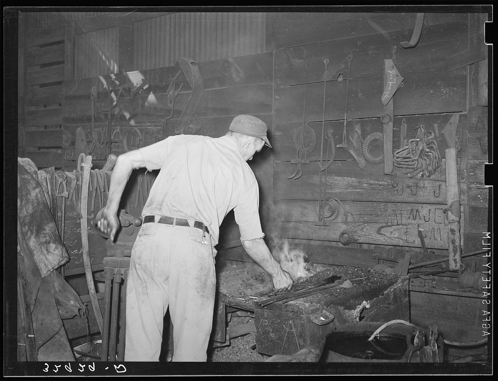 Blacksmith at work. San Augustine, Texas by Russell Lee