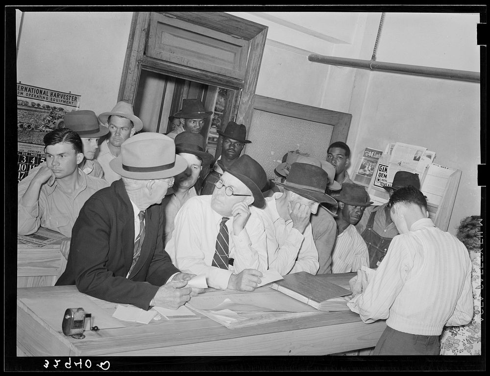 Scene in county agent's office, waiting for checks. San Augustine, Texas by Russell Lee