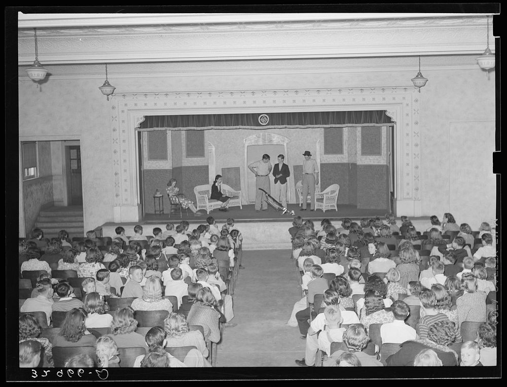 [Untitled photo, possibly related to: Schoolchildren watching senior class play. San Augustine, Texas] by Russell Lee
