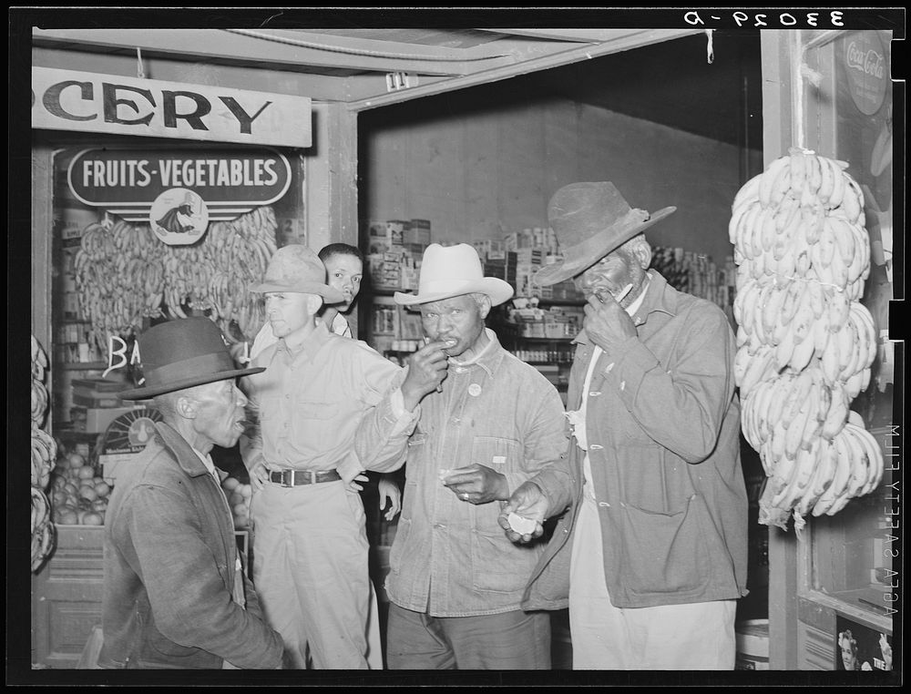  farmers in front of grocery store. San Augustine, Texas by Russell Lee