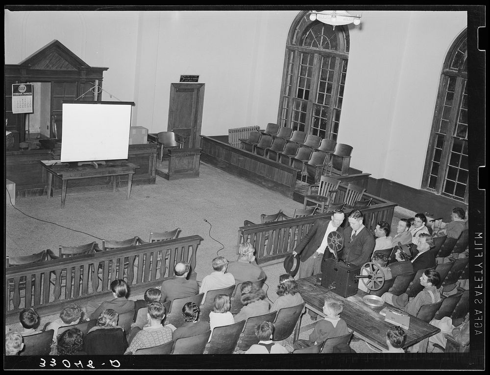 Waiting for Department of Agriculture movie to start. Courtroom, San Augustine, Texas by Russell Lee