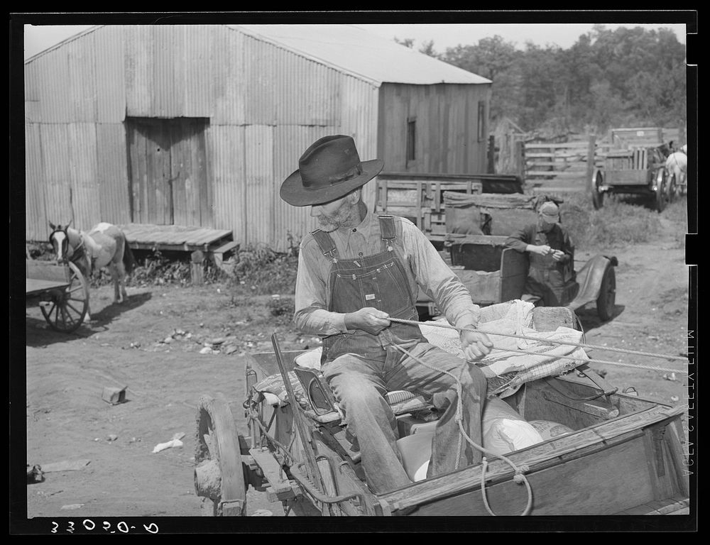 Farmer with loaded wagon leaving town. San Augustine, Texas by Russell Lee
