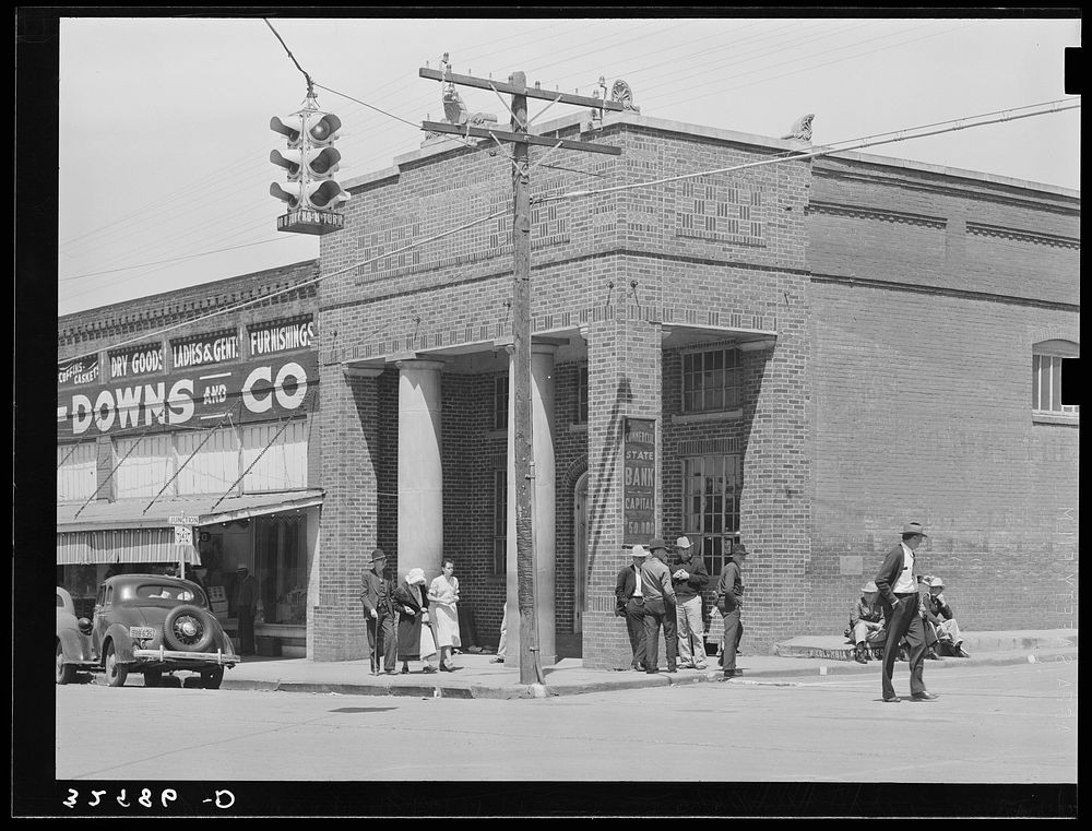 [Untitled photo, possibly related to: Bank corner on main street. San Augustine, Texas] by Russell Lee