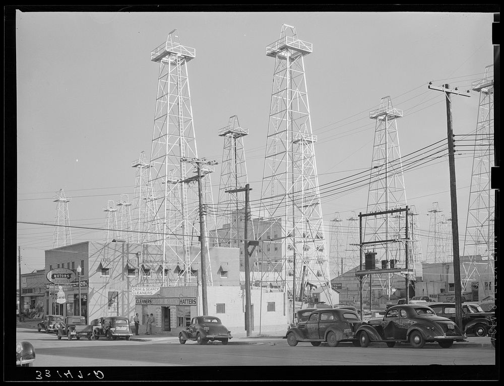Downtown section of Kilgore, Texas, studded with oil derricks by Russell Lee