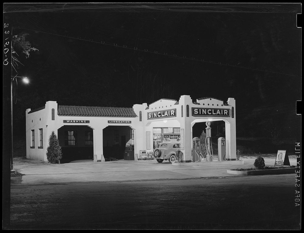 [Untitled photo, possibly related to: Oil and gasoline service station, San Augustine, Texas, at night] by Russell Lee