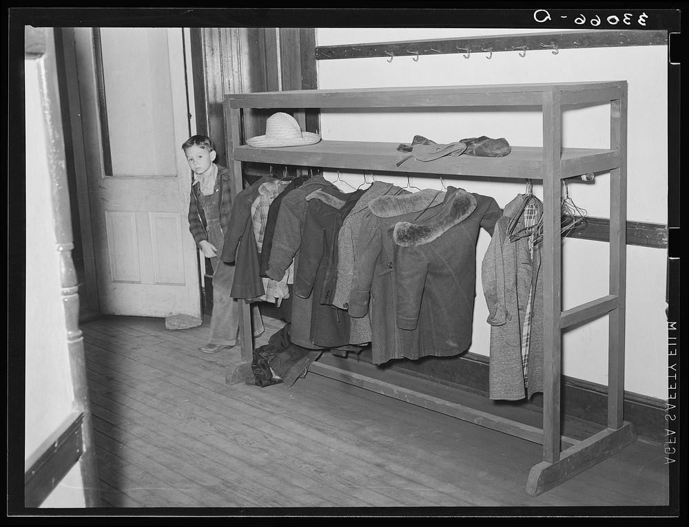 Coat rack in hall. Grade school, San Augustine, Texas by Russell Lee