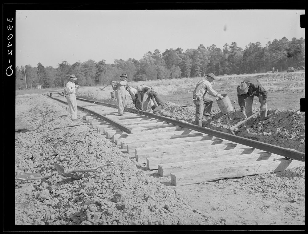 Laying track at Southern Paper mill. Lufkin, Texas by Russell Lee