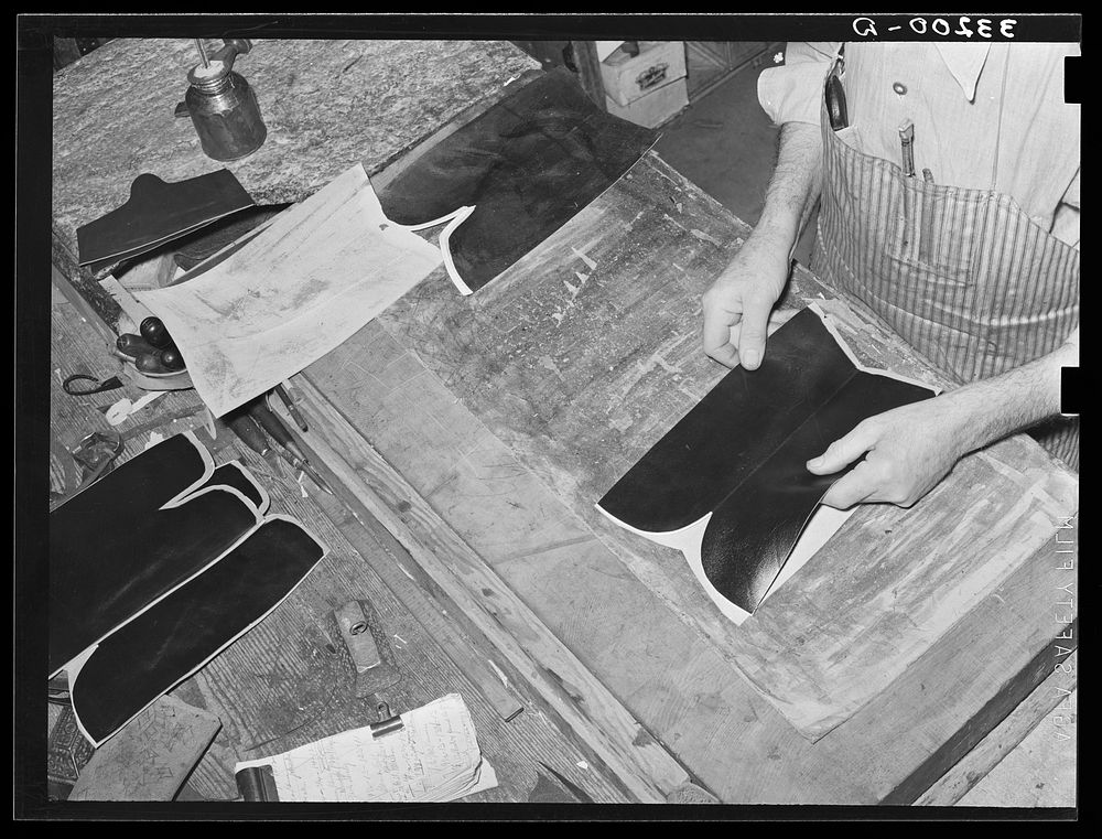 Stitching uppers together. Bootmaking shop, Alpine, Texas by Russell Lee