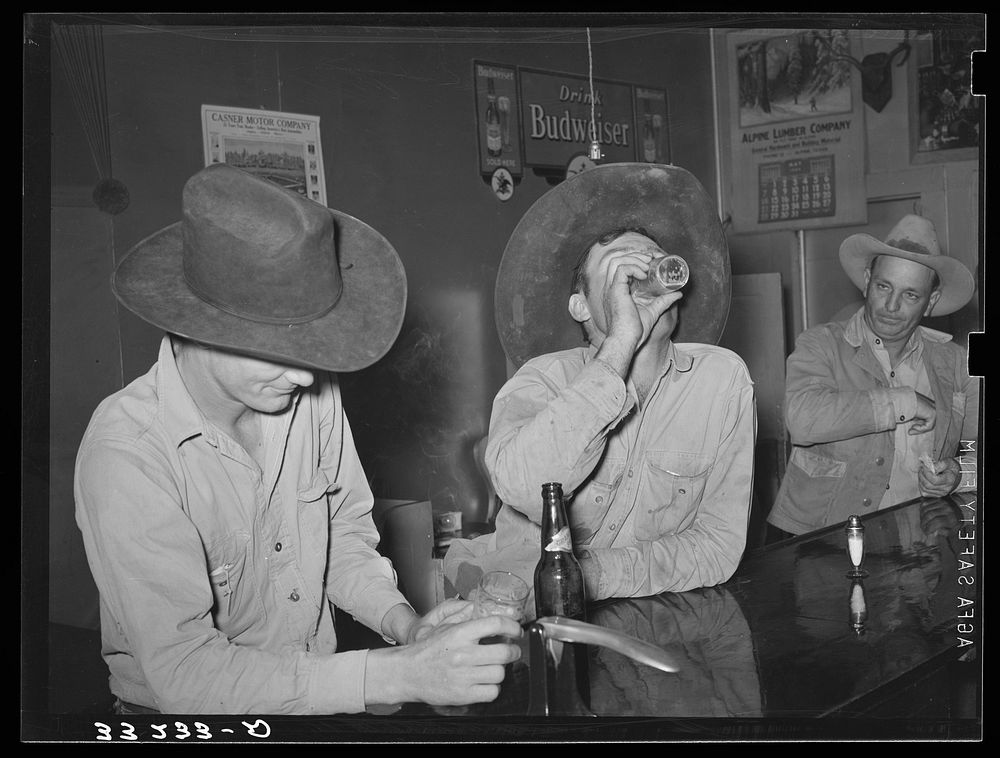 Cowboys in beer parlor. Alpine, Texas by Russell Lee
