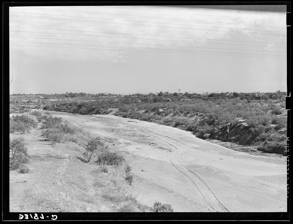 Wagon tracks down the dry bed of the Colorado River at Colorado, Texas. Rivers and streams of the Southwest are often dry…