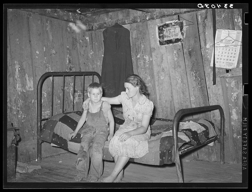 Daughter and son of agricultural day laborer living near Webbers Falls, Oklahoma. The furnishings of this shack were meager…