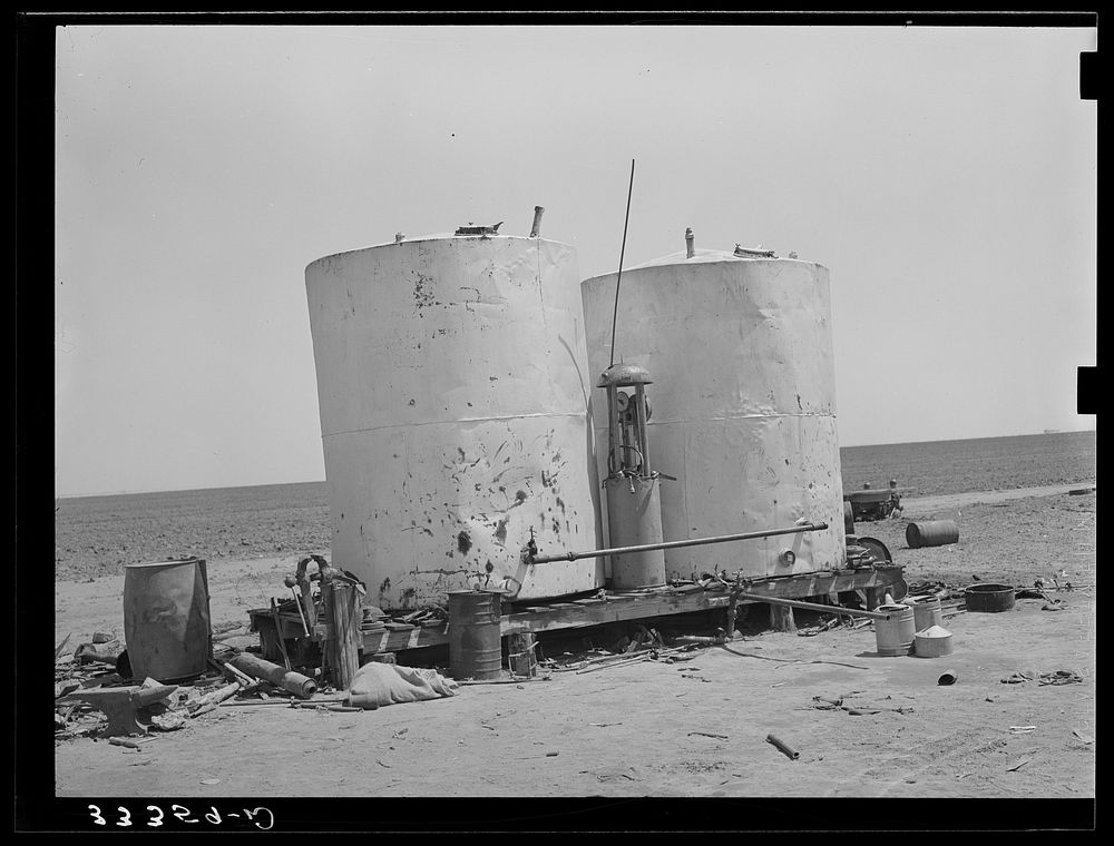 [Untitled photo, possibly related to: Gasoline storage tanks on 4900 acre farm near Ralls, Texas] by Russell Lee