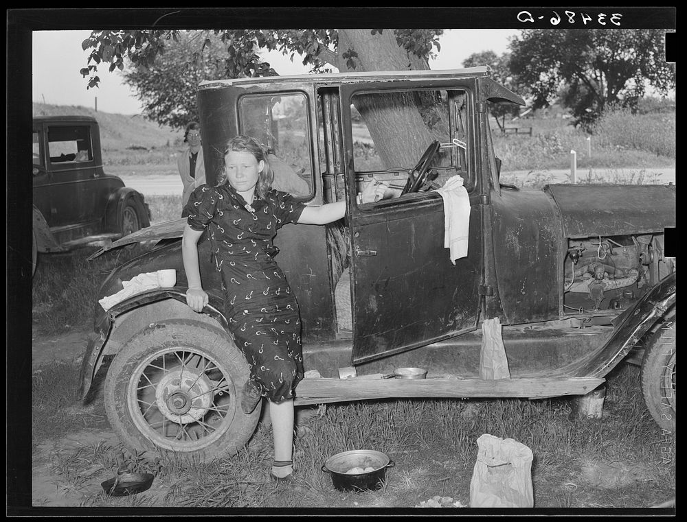 White migrant woman at side of automobile while camped near Prague, Oklahoma. Lincoln County, Oklahoma by Russell Lee