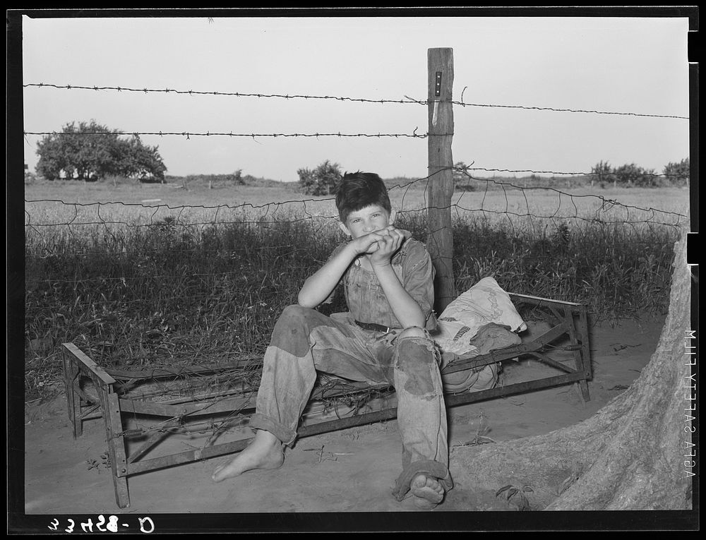 Son of day laborer living in Arkansas River bottoms near Webbers Falls. Muskogee County, Oklahoma by Russell Lee