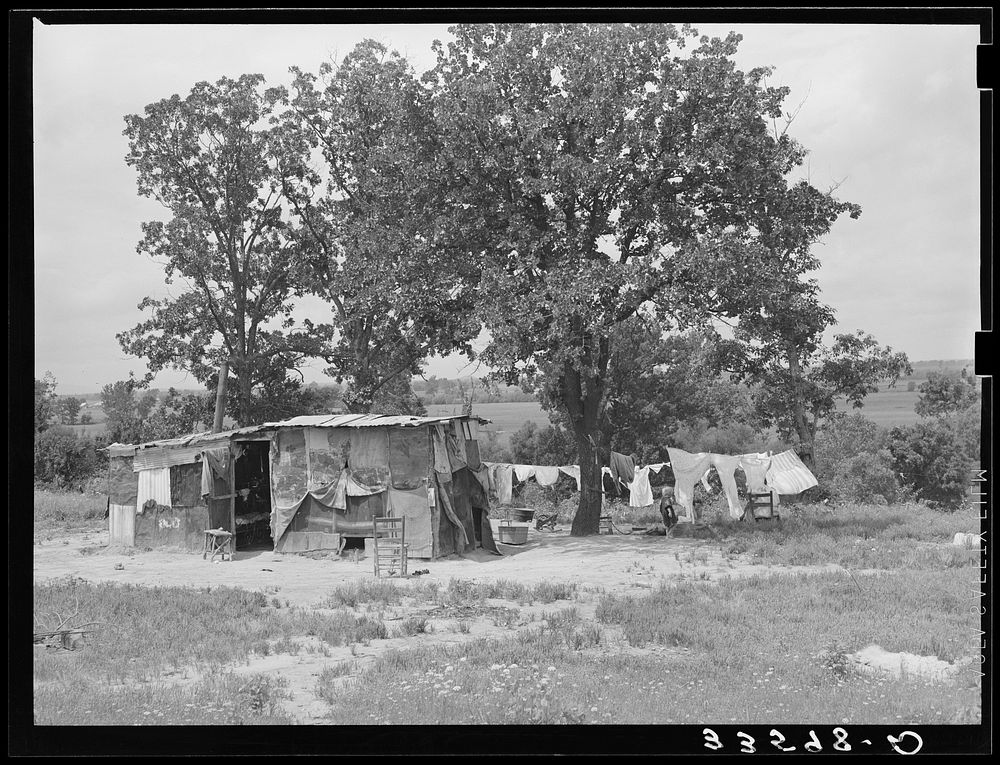Home of agricultural day laborer's family who cared for his tubercular wife and two children. Poteau Creek near Spiro…