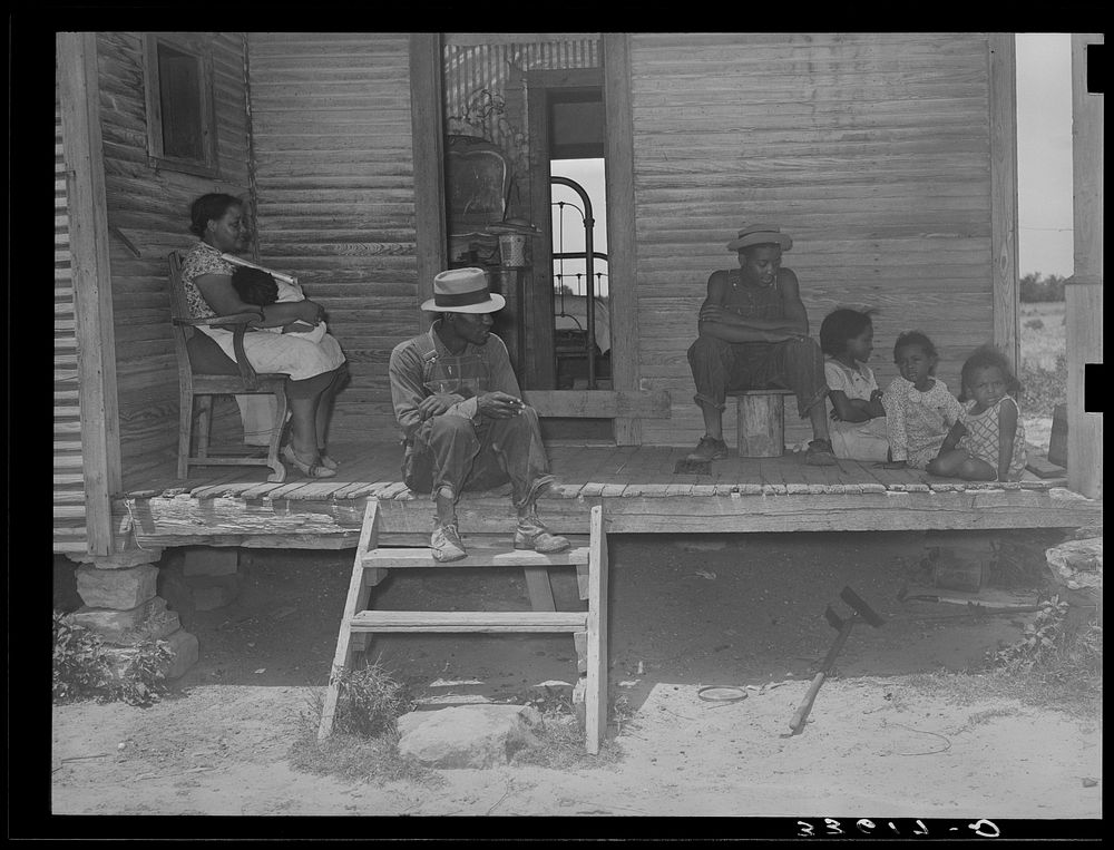 [Untitled photo, possibly related to:  tenant farmer and his family on front porch of their home in Wagoner County…